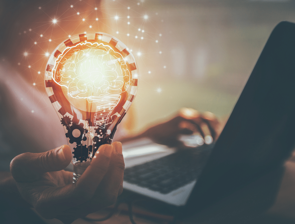 dms_automation Glühbirne mit Zahnrädern als Symbol für automatisierte Geschäftsprozesse.